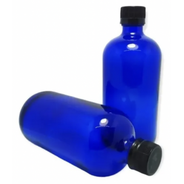 Frasco de vidrio azul con...